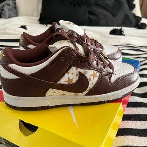 Brown and white Nike dunks. Never worn. Was gifted from someone.